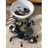 A QUANTITY OF MIXED FISHING REELS AND LINE TO INCLUDE RYOBI, SHAKESPEARE ETC