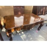 A REPRODUCTION BURR WALNUT CROSSBANDED COFFEE TABLE ON CABRIOLE LEGS