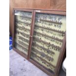 A VERY LARGE WOODEN DISPLAY CABINET WITH APPROXIMATELY 295 COLLECTABLE TEA SPOONS, WIDTH 152CM,