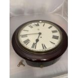 A TRADE MARK D MAHOGANY CASED WALL CLOCK WITH KEY