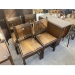 AN OAK DROP-LEAF TABLE AND FOUR CHAIRS