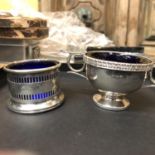 TWO HALLMARKED SILVER SALTS WITH BLUE GLASS LINERS