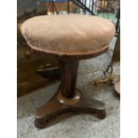 A VICTORIAN WALNUT ROTATING PIANO STOOL WITH AN UPHOLSTERED SEAT