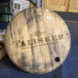 A ROUND WOODEN 'TALISKER' BARREL TOP