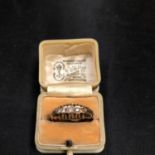 A 9CT GOLD RING WITH FIVE IN LINE CLEAR STONES (ONE MISSING) 1.3 GRAMS