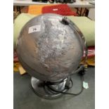 A SILVER LIGHT-UP GLOBE