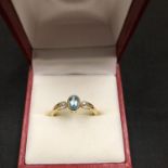 A 9CT GOLD AQUAMARINE AND DIAMOND CHIP RING 1.5 GRAMS