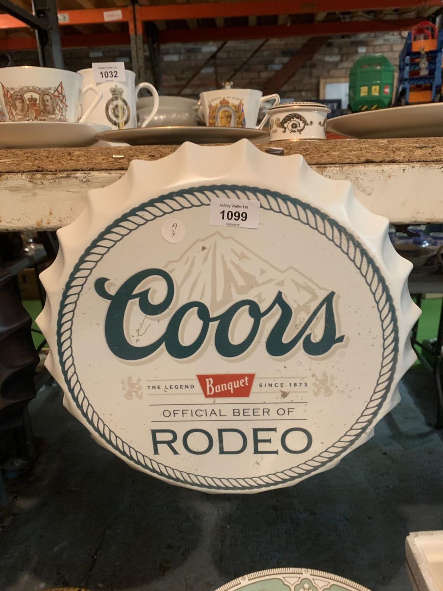 A VINTAGE GARAGE RETRO COORS RODEO HANGING BOTTLE TOP DISPLAY SIGN 35CM