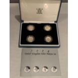 A BRITTANIA 2004 SILVER PROOF FOUR £1 COIN PATTERN SET IN PRESENTATION BOX WITH CERTIFICATE