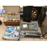 A VINTAGE WOODEN BOX WITH COPPER FITTINGS, WORKSHOP FOLDAWAY CART, A DARTBOARD IN CASE, HEAVY DUTY