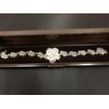 A BOXED SILVER FLORAL BRACELET