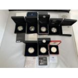 EIGHT VARIOUS SILVER PROOF £5 COINS IN PRESENTATION BOXES WITH CERTIFICATES