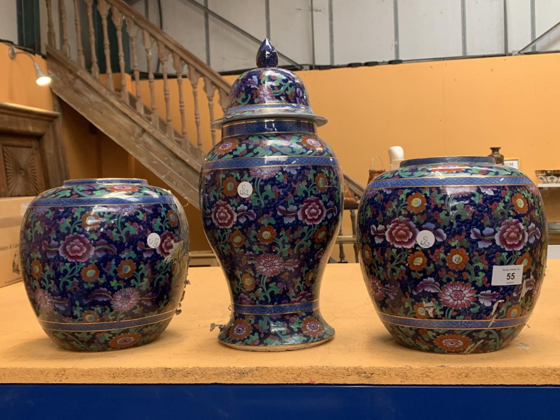 TWO LARGE VASES AND A LIDDED URN