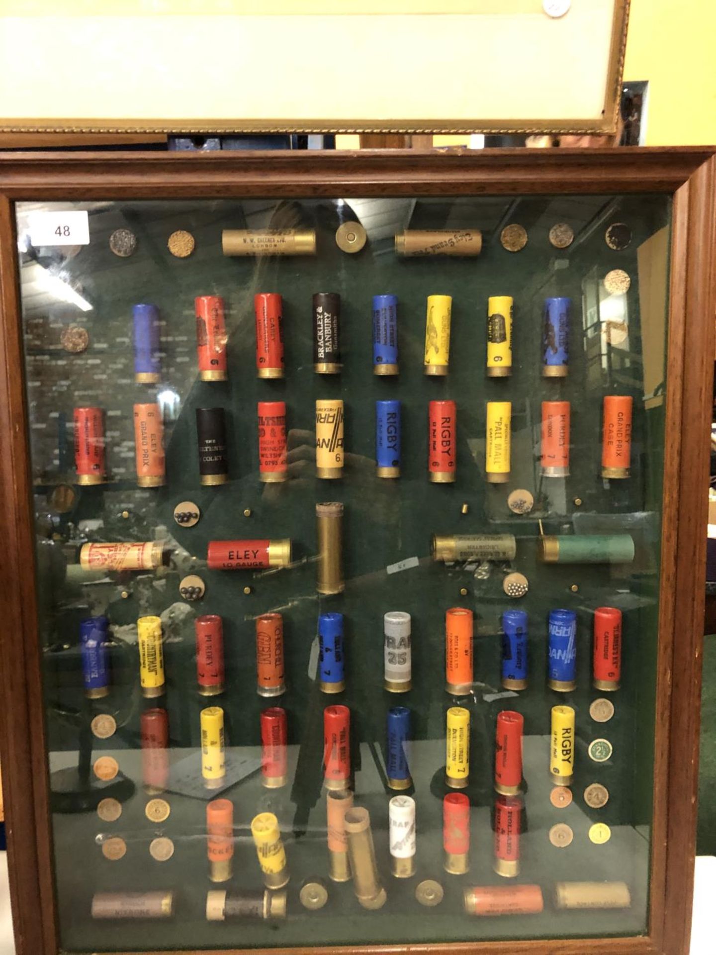 A COLLECTION OF CARTRIDGES IN A FRAMED CASE