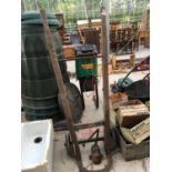 A VINTAGE WOODEN SACK TRUCK WITH LAIDLAW & THOMPSON FIRE DOOR HINGE BRACKET