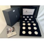 A SET OF 17 SILVER PROOF 1oz COINS - THE QUEENS 80TH BIRTHDAY IN WOODEN PRESENTATION BOX WITH