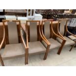 A SET OF FOUR HARDWOOD OPEN ARM ELBOW CHAIRS WITH UPHOLSTERED SEATS AND BACK