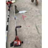 A HOMELITE PETROL STRIMMER