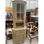 A PINE EFFECT CORNER CABINET