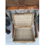 A VINTAGE SUITCASE AND WICKER PICNIC BASKET