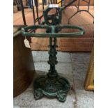 A GREEN CAST IRON WALKING STICK AND UMBRELLA STAND