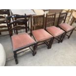 THREE OAK SPINDLE BACK DINING CHAIRS AND A LADDERBACK CHAIR