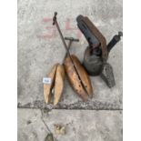 A PAIR OF VINTAGE SHOE STRETCHERS AND A BRASS BOW LAMP
