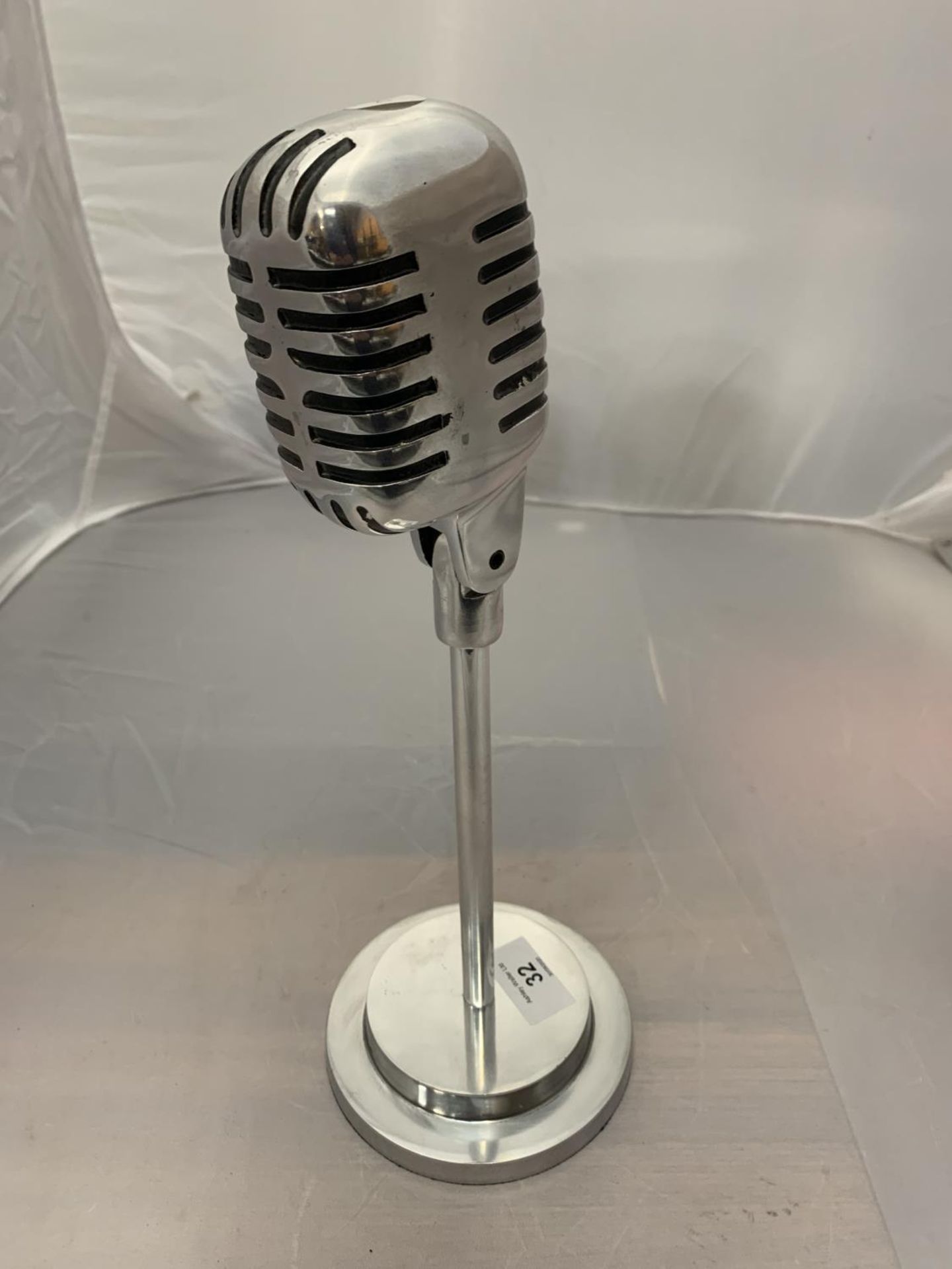 A CHROME OLD FASHIONED STYLE MICROPHONE