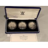 A BRITTANIA 2001 SILVER PROOF THREE £5 COIN SET IN PRESENTATION BOX WITH CERTIFICATE