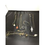 A ROLLED GOLD NECKLACE AND A QUANTITY OF NECKLACES AND BRACELETS