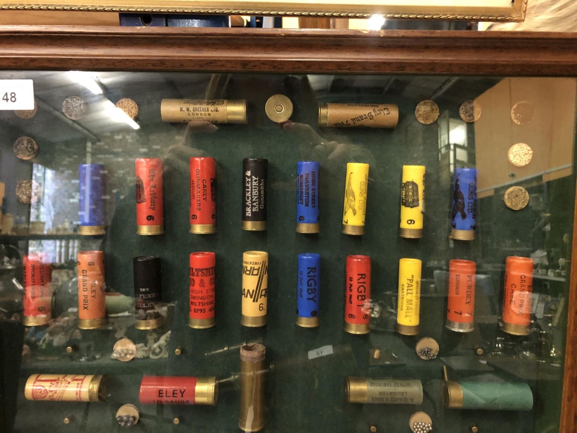 A COLLECTION OF CARTRIDGES IN A FRAMED CASE - Image 2 of 3