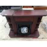 A MAHOGANY FIRE SURROUND WITH AN ELECTRIC COAL EFFECT FIRE BELIEVED WORKING BUT NO WARRANTY