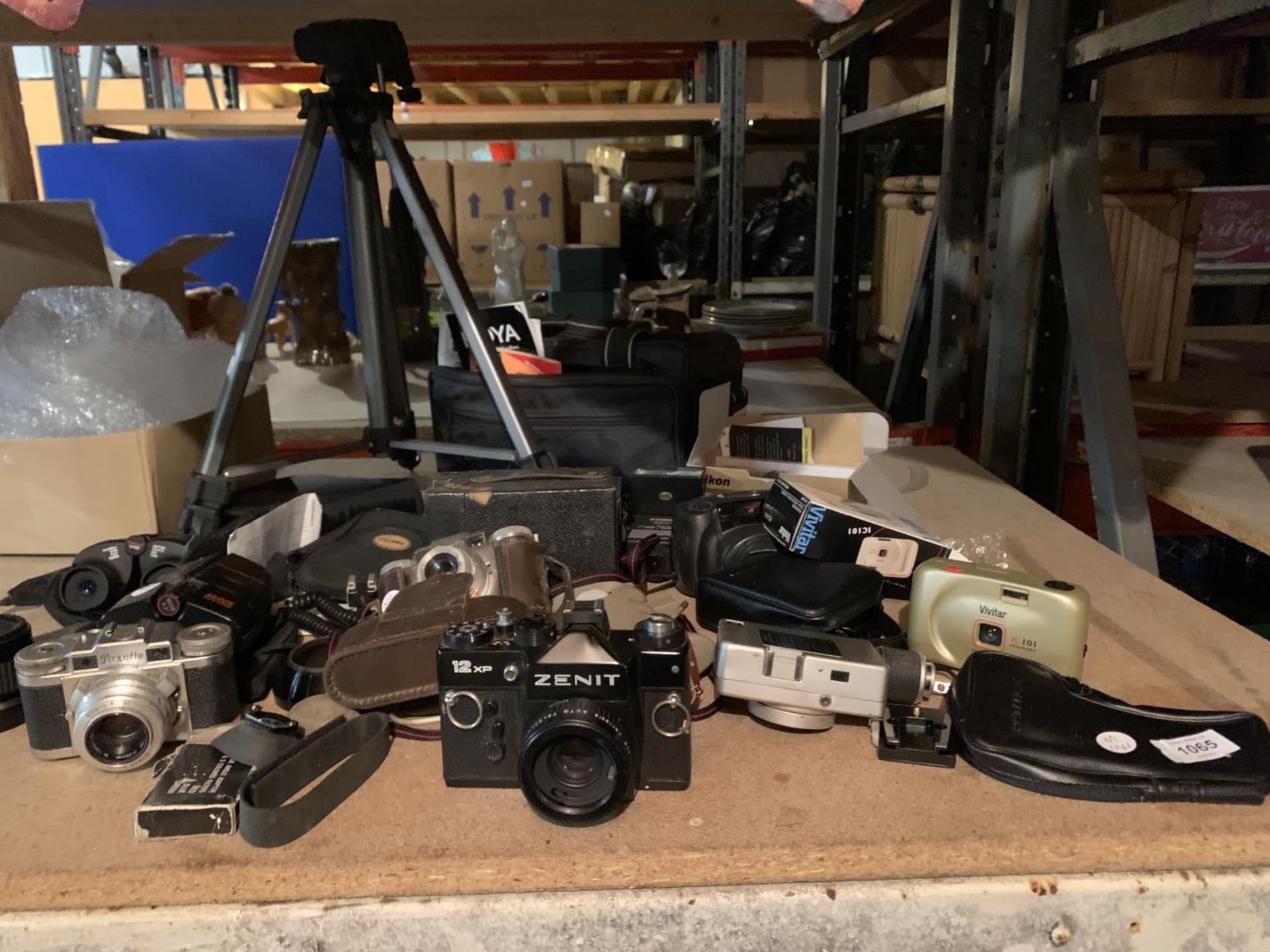 A QUANTITY OF CAMERAS TO INCLUDE ZENIT, VIVIT, PAXETTE, TWO PAIR OF BINOCULARS AND A TRIPOD