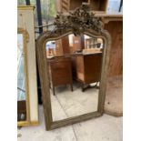 A 19TH CENTURY GILT FRAMED WALL MIRROR, 56x33" WITH FOLIATE DECORATION TO THE TOP RAIL