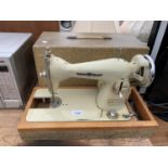A DELUXE SOVEREIGN VINTAGE BOXED SEWING MACHINE