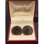 A PAIR OF COIN CUFF LINKS