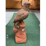 A TERRACOTTA BIRD OF PREY ROOF FINIAL