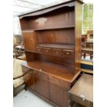 A STAG MINSTREL MAHOGANY DRESSER WITH THREE DOORS, THREE DRAWERS, FOUR UPPER DRAWERS AND ONE DOOR