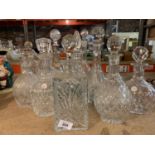 TWELVE CUT GLASS DECANTERS