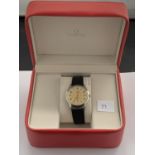A BOXED GENTS OMEGA VINTAGE CHAMPAGNE DIAL WRIST WATCH