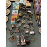 A LARGE COLLECTION OF SPELTER PENCIL SHARPENERS IN VARIOUS INTERESTING SHAPES TO INCLUDE A HARP,