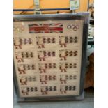 A LARGE FRAMED COLLECTION OF ROYAL MAIL FIRST DAY COVERS OF GOLD MEDAL WINNERS AT THE LONDON