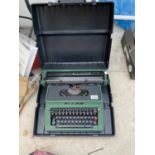 A VINTAGE SILVER REED 500 TYPEWRITER IN CASE