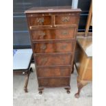 A TALL MAHOGANY CHEST OF TWO SHORT AND FIVE LONG DRAWERS