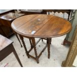 AN EARLY 20TH CENTURY OAK OVAL GATELEG TABLE ON BARLEYTWIST LEGS