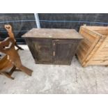 A PITCH PINE CABINET WITH TWO DOORS