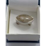 A BOXED WHITE METAL RING WITH STONE