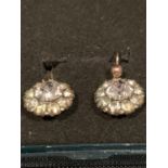 A PAIR OF YELLOW METAL (POSSIBLY GOLD) DIAMANTE EARRINGS