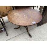 A GEORGE III LOW MAHOGANY TILT TOP TRIPOD TABLE, 35" DIAMETER, WITH ONE PIECE TOP