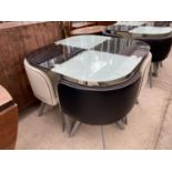 AN ART DECO STYLE GLASS TOP TABLE AND FOUR CHAIRS UPHOLSTERED IN BLACK AND WHITE VINYL ON SPLAY FEET